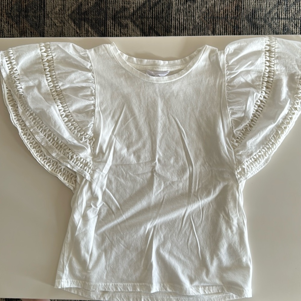 Anthropologie knit top with embroidered sleeves